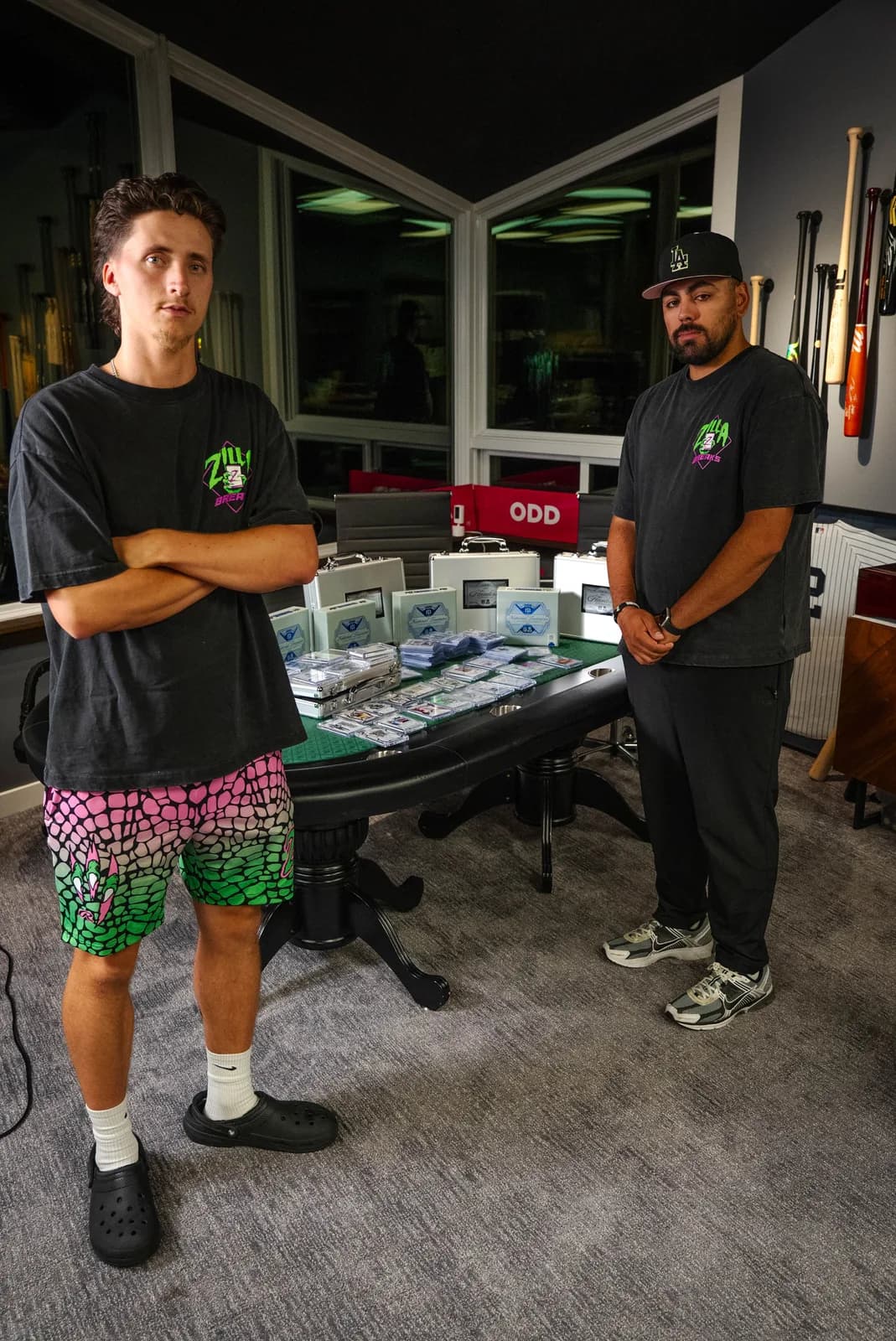 Zilla Breaks team members beside premium cards and custom collector cases